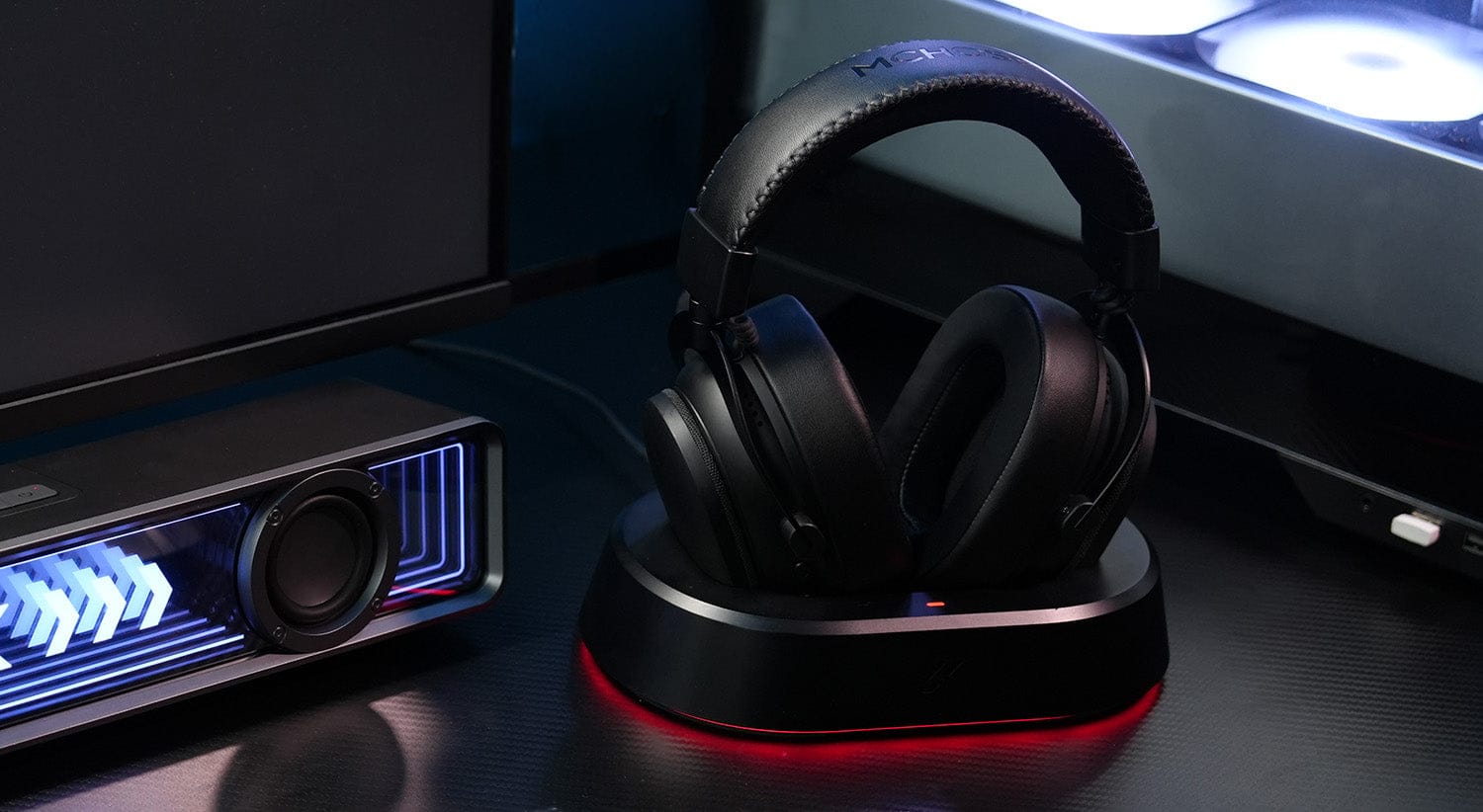 MCHOSE V9 Turbo headset resting on desktop gaming setup