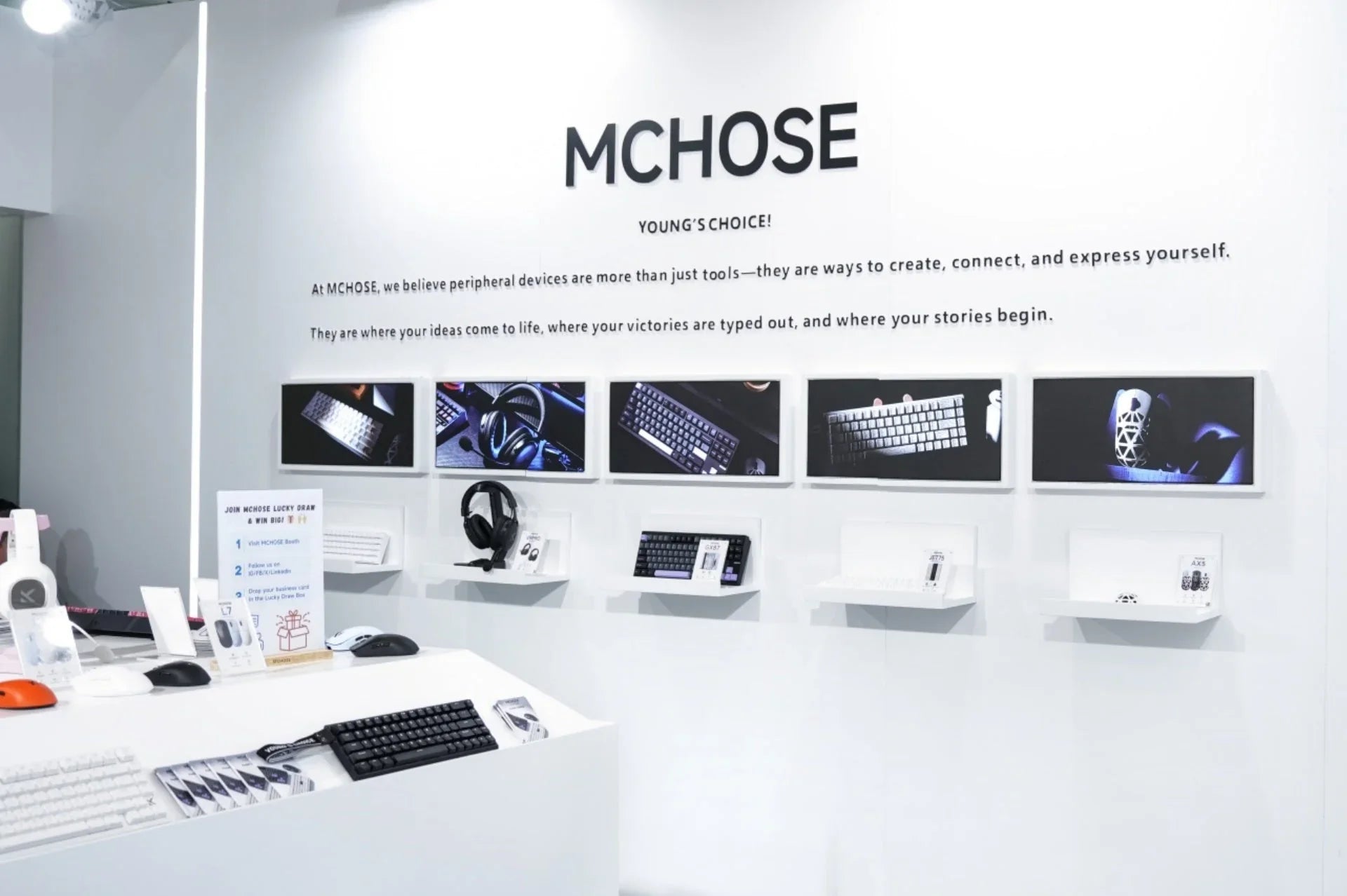 MCHOSE booth displaying keyboards, mice, and headsets for gaming and productivity