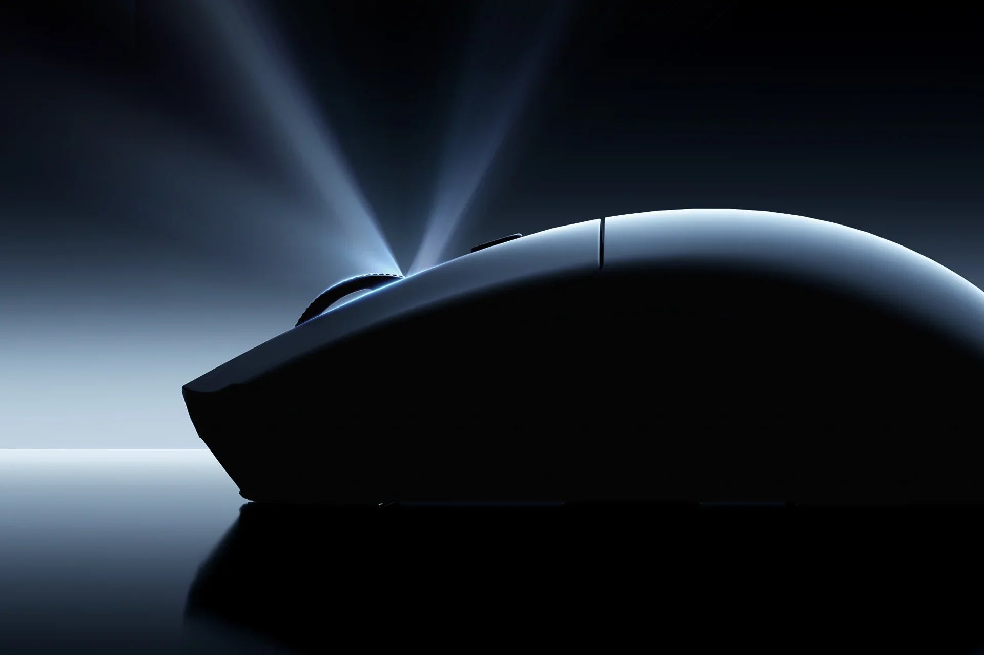 Ergonomic gaming mouse with sleek design, illuminated by dramatic spotlight for precision and style.